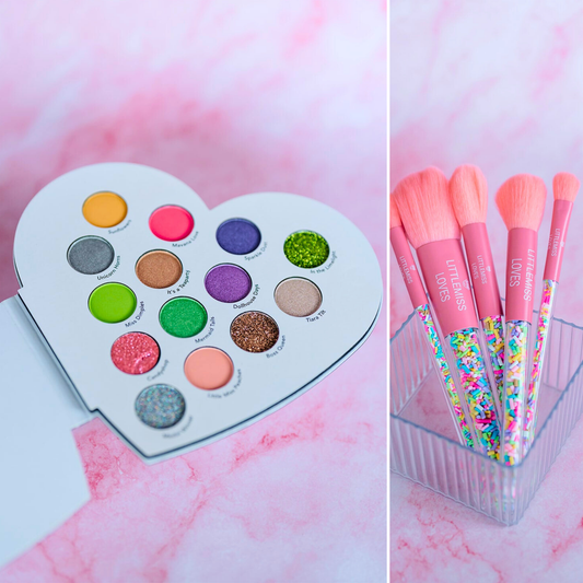Heart-shaped makeup palette with colorful shades and pink makeup brushes on a pink marble background