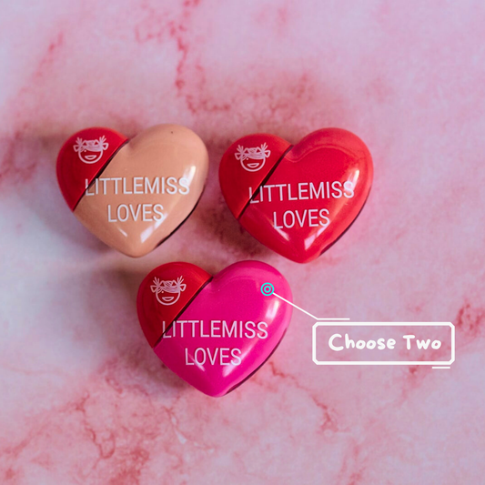 Heart-shaped containers with 'LITTLEMISS LOVES' branding on a pink marble background.